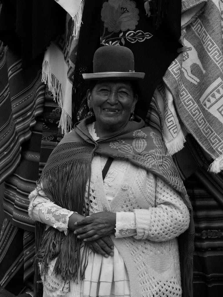 portrait of a woman in a bowler hat and shawl, in black and white